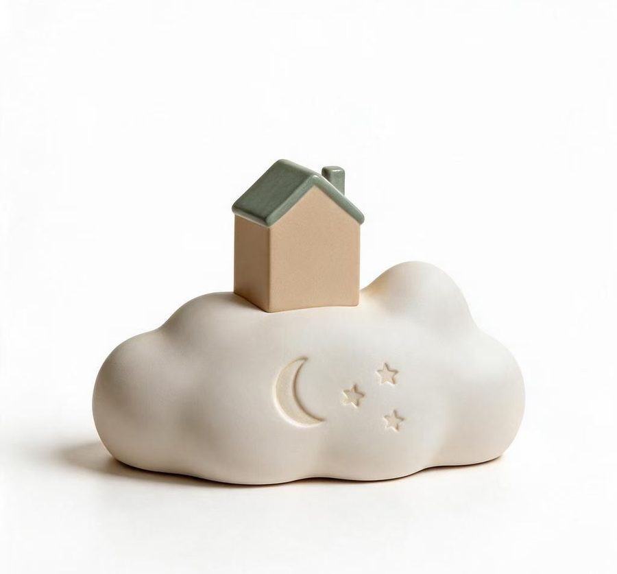 The back of the CloudHaven memorial with a crescent moon and small stars pressed into the cloud